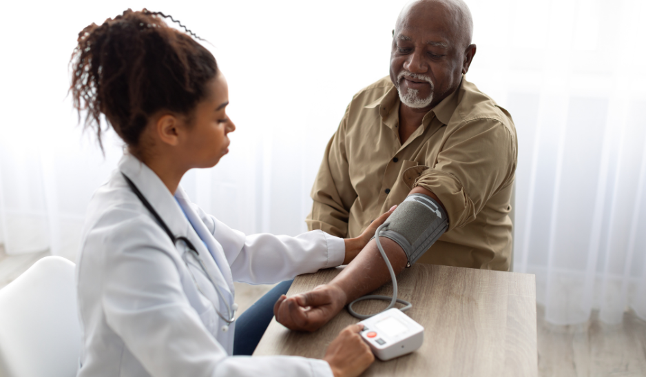 Older man visiting with his respiratory therapist.